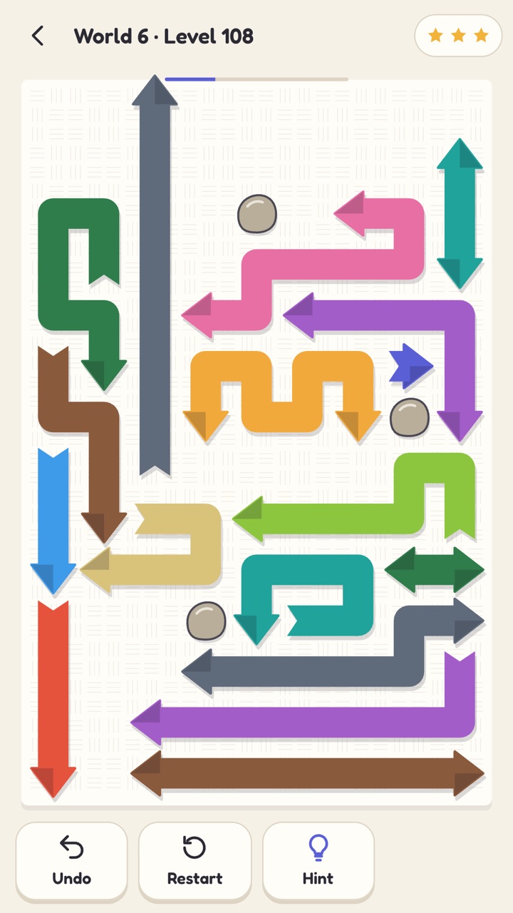 Loose Ends: a tangle of coloured paper ribbons with arrow heads, one sliding off the board